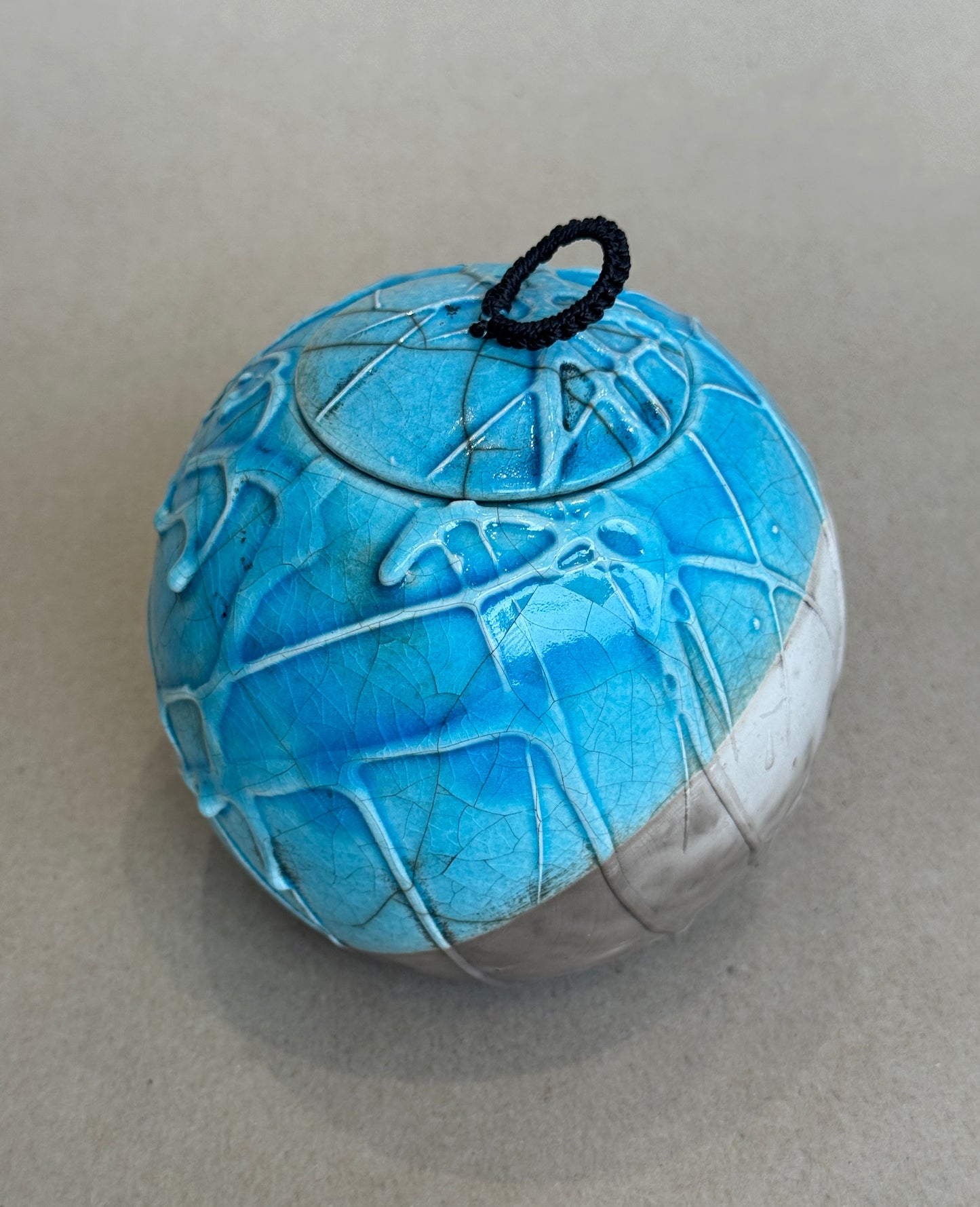 Medium Raku Fired Porcelain Jar (slip pour)
